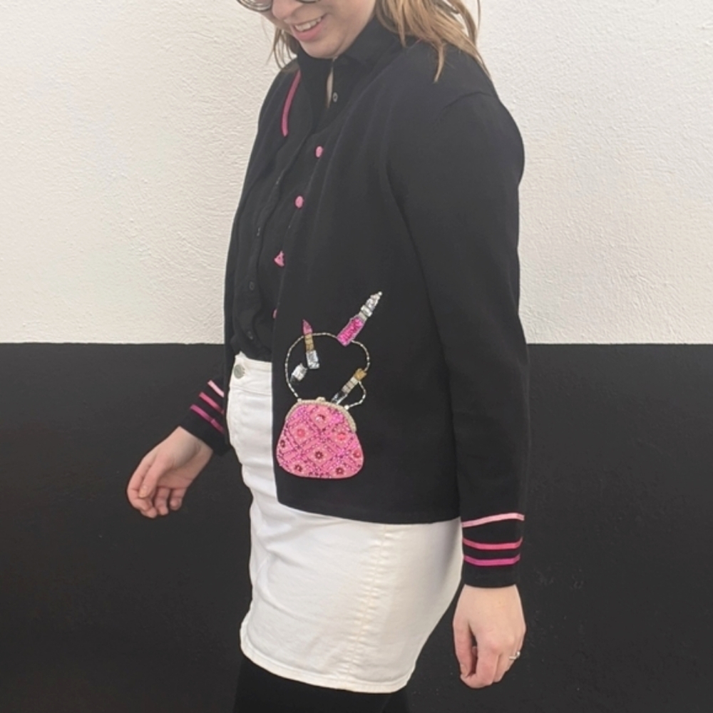 Michael Simon pink beaded lipstick black cardigan